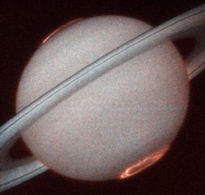 Saturn's Northern and Southern Lights are visible in this photo taken by the Hubble Space Telescope